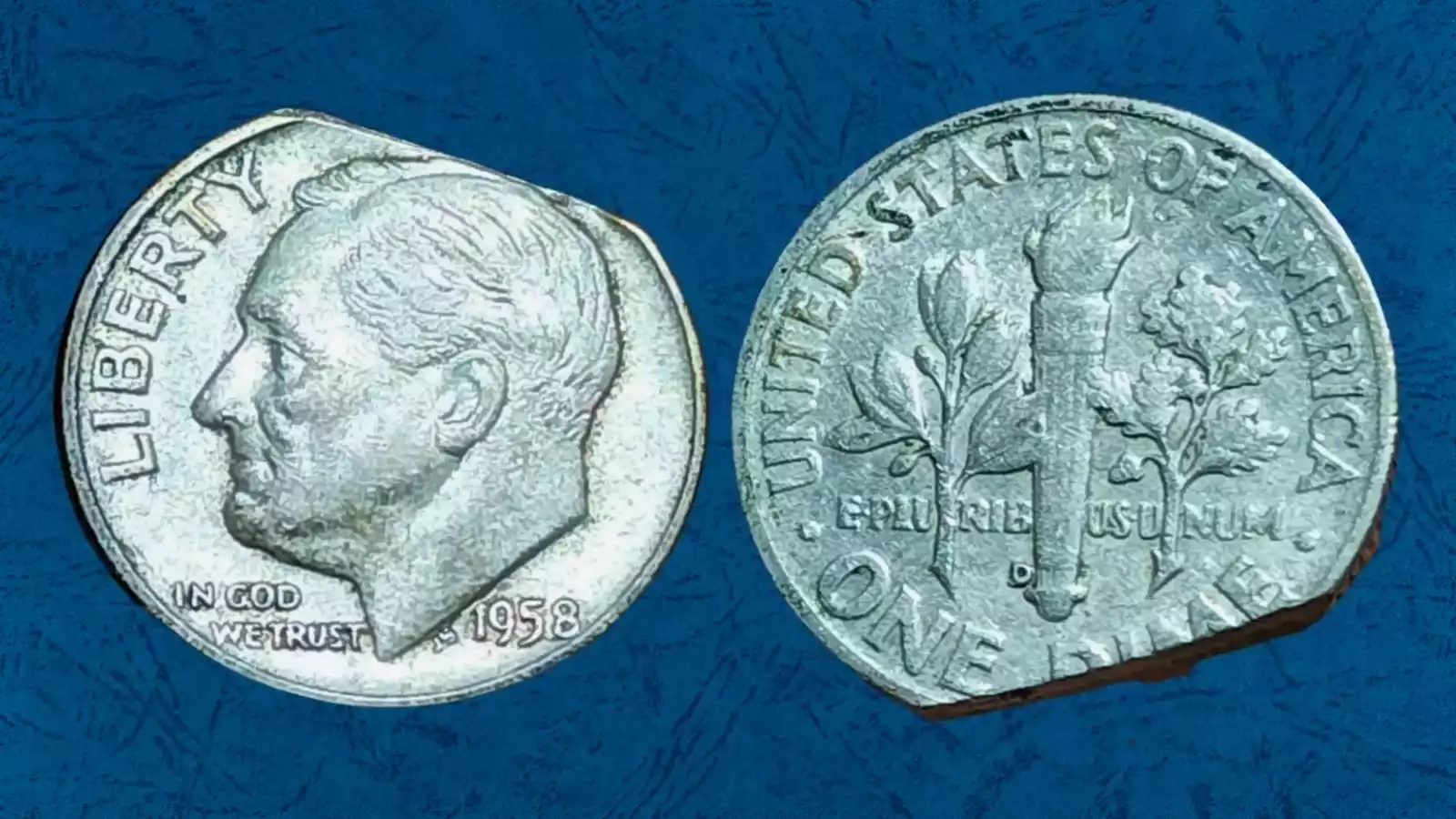 1958 Roosevelt dime clipped planchet error showing missing section of the coin's edge